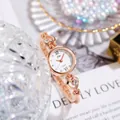 Elegant rose gold quartz watch with heart-shaped bracelet and Roman numeral dial - Rose Gold
