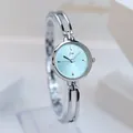 Minimalist women's watch with light blue sunray dial and silver openwork bangle band - Silver Case Blue Dial