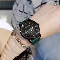 Macro detail of GoGoey watch with multi-function dials and dark green leather strap - Green