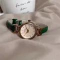 Vintage GoGoey women's quartz watch with gold round case and slim green leather strap - Green