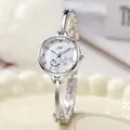 Elegant silver bangle watch for women with round dial and cute whale heart pattern - Silver White Dial