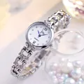 Elegant silver quartz watch with hollow streamline bracelet and blue hands on white dial - Silver