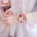 Women's quartz watch with red leather strap and celestial moon star charm bracelet - Red