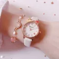 Elegant rose gold watch with white leather strap and matching moon charm bracelet - White