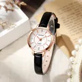 Close-up of rose gold quartz watch with white dial, diamond markers and black leather strap - Black