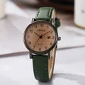 Detailed view of JSHIA quartz watch with dark green leather strap and date display - Green