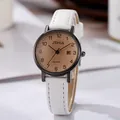 Detailed side view of the white leather strap and champagne dial with calendar window - White