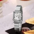 Macro view of a silver square lady's watch with Roman numeral dial and link strap - Silver Band White Dial