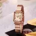 Detail of rose gold square watch with roman numerals and metallic link strap - Rose Gold Dial