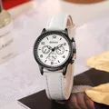 Detailed macro view of white crocodile pattern leather strap and multi-dial watch face - White