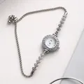 Detail of silver ladies' chain watch featuring rhinestone bezel and drawstring sliding clasp - Silver Band White Dial