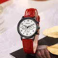 Detailed macro of red leather strap watch with black casing and multi-dial face - Red