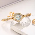 Elegant gold quartz bracelet watch for women featuring a sparkling rhinestone floral band - Gold White Dial