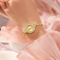 Elegant gold quartz watch for women featuring a crystal bezel and delicate chain strap - Gold Band Gold Dial
