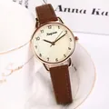 Elegant rose gold women's quartz watch with brown leather strap and textured beige dial - Coffee