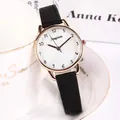 Elegant women's quartz watch with black leather strap and rose gold case by a ceramic cup - Black