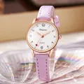 Macro view of white dial quartz watch with red heart second hand and lavender glitter strap - Fuschia
