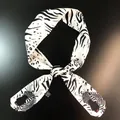 Detail of zebra and leopard print satin scarf tied in a bow with realistic zebra motif - Zebra Leopard Print (C141-2)