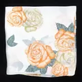 Detailed view of square silk scarf with orange peony floral print and hand-rolled edges - Standard Spec / Beige