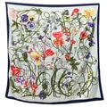 Close-up detail of silk square scarf featuring vibrant floral botanical prints and butterflies - Light Blue