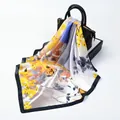 Ivory oil painting silk square scarf with yellow leaf patterns draped on a black bag - Yellow