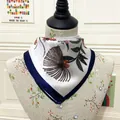 Detail of a 60cm silk square scarf with navy borders and botanical flower prints - 60CM / White