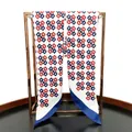 Detailed shot of hand-rolled edges on twill silk scarf with chain link pattern - Navy Blue