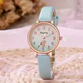 Detailed close-up of cute cat motif on light blue leather strap wristwatch for women - Blue