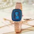 Elegant rose gold women's watch with blue rectangular dial and woven steel mesh band - Blue