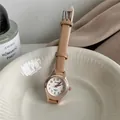 Elegant rose gold women's quartz watch with small white dial and tan leather strap - Coffee