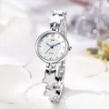 Macro view of silver star-linked watch bracelet with heart pattern dial and rhinestones - Silver White