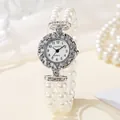 Elegant ladies quartz watch with pearl stretch bracelet and rhinestone-studded bezel - White