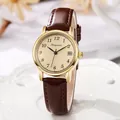 Classic round quartz watch with date calendar, brown leather strap, and gold metal case - Brown Strap Yellow Dial