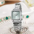 Close-up of square silver watch with light blue sunray dial on elegant white ceramic - Blue Dial (KQN950)