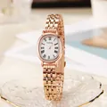 Elegant rose gold oval women's watch with Roman numerals and a stylish metal chain strap - Rose Gold White Dial