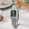 Close-up of elegant square silver mesh watch with black dial and minimalist markers - Silver Mesh Black Dial