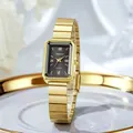 Close-up of a rectangular gold quartz watch with a black dial on a white ceramic tray - Gold Band Black Dial