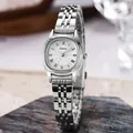 Montre élégante en acier inoxydable argenté pour femme avec cadran ovale et chiffres romains - Bracelet Argent Boîtier Argent Cadran Blanc