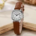 Macro detail of silver tonneau case with Roman numerals and brown leather strap texture - Brown Strap Silver Case White Dial