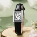 Close-up of vintage square silver watch on wood with black leather strap and Roman numerals - Black Strap - Silver Case White Dial