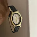 Elegant vintage oval gold quartz watch with a black leather strap for women - Black