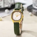 Detail of vintage gold rectangular watch case with dark green leather strap and white dial - Green Strap Gold Case White Dial