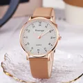 Minimalist quartz watch with rose gold case and brown leather strap on elegant tray - Khaki Strap White Dial