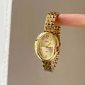 Detail of gold oval quartz watch with elegant metal chain strap and minimalist dial - Gold Steel Strap Gold Dial