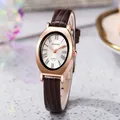 Detailed close-up of retro oval quartz watch with roman numerals and brown leather strap - Coffee Strap Rose Gold Case White Dial