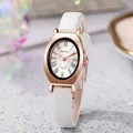 Detailed macro view of an oval rose gold watch case with white crocodile leather strap - White Strap Rose Gold Case White Dial
