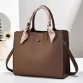 Elegant brown leather tote bag with decorative silk scarf and detachable strap - Brown