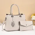 Fashionable beige quilted handbag with pearl leaf pendant and matching envelope clutch set - Off-white
