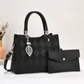 Black quilted faux leather tote and clutch set with pearl leaf charm and shoulder strap - Black