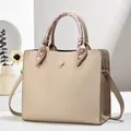 Beige lychee leather tote bag with elegant floral scarf handle and long shoulder strap - Khaki